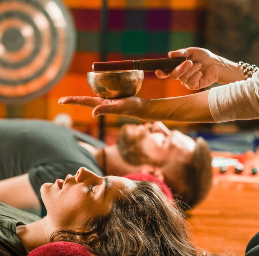 Group meditation in a candle-lit room