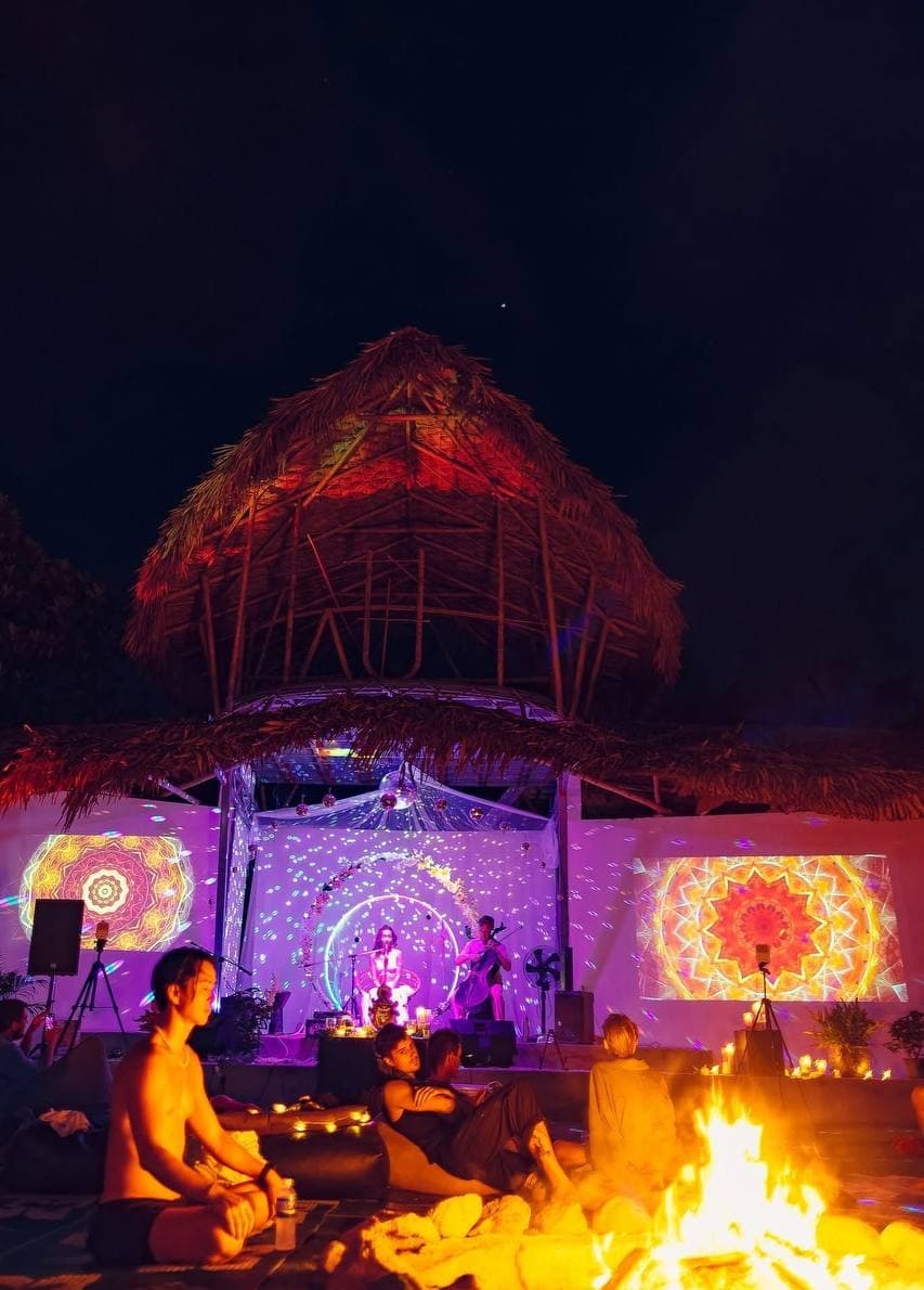 Evening sound bath under the AUM dome with mandala light projections and fire